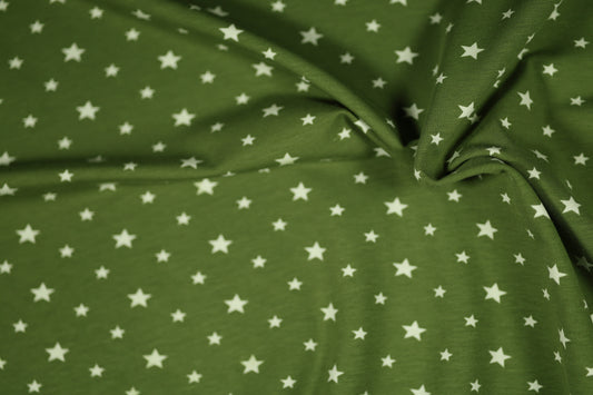 Grüner Stoff mit Sternenmuster – frisch & kindgerecht.