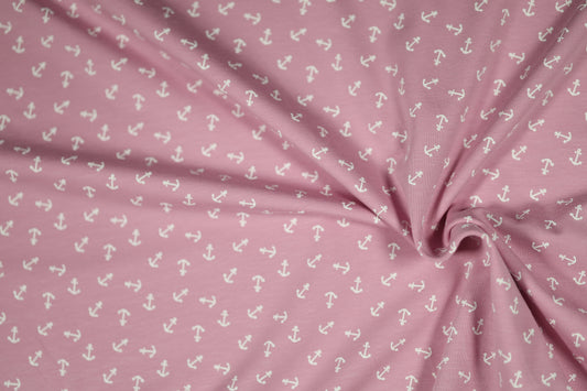 Baumwollstoff mit Motiv: weiße anker auf altrosa – weich & kindgerecht.