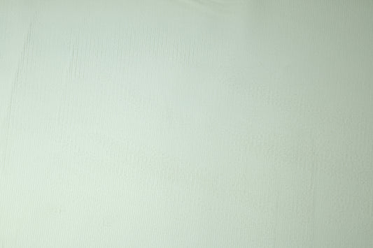 Cremefarbener Baumwoll-Cordstoff Nahaufnahme