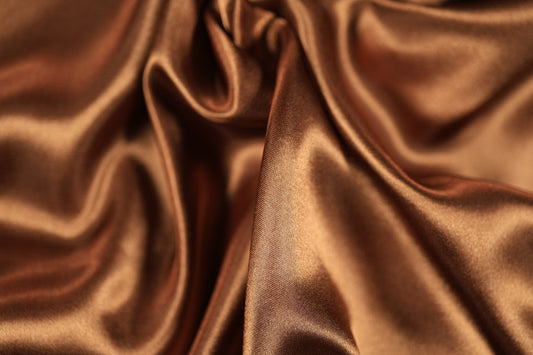 Kupferfarbener Dekor-Satin Stoff leicht glänzend