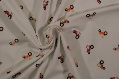 Ecrufarbener Baumwolljersey mit kleinen Traktoren