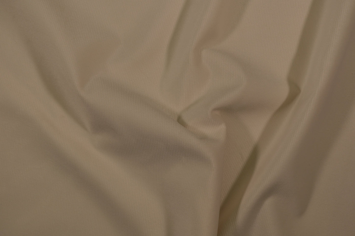 Möbelstoff in Uni-Creme mit glatter, feiner Struktur Detailaufnahme der Stoffstruktur