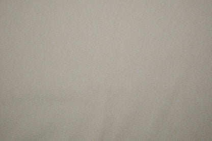 Heller Bouclé Möbelstoff in Creme – strukturierter Polsterstoff für moderne Wohnräume Detailaufnahme der Stoffstruktur