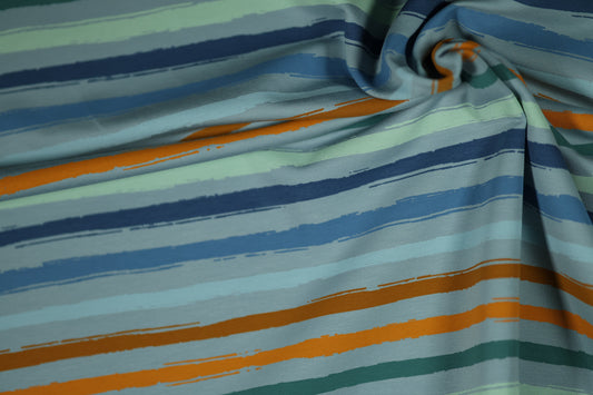 Baumwollstoff mit Streifen in Blau, Türkis und Orange – lebendig & kreativ.