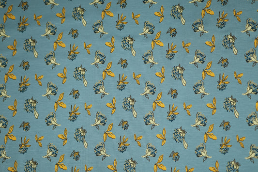 Gelbe Blätter auf Himmelblau – hochwertiger Baumwollstoff für Kinder und kreative Projekte.